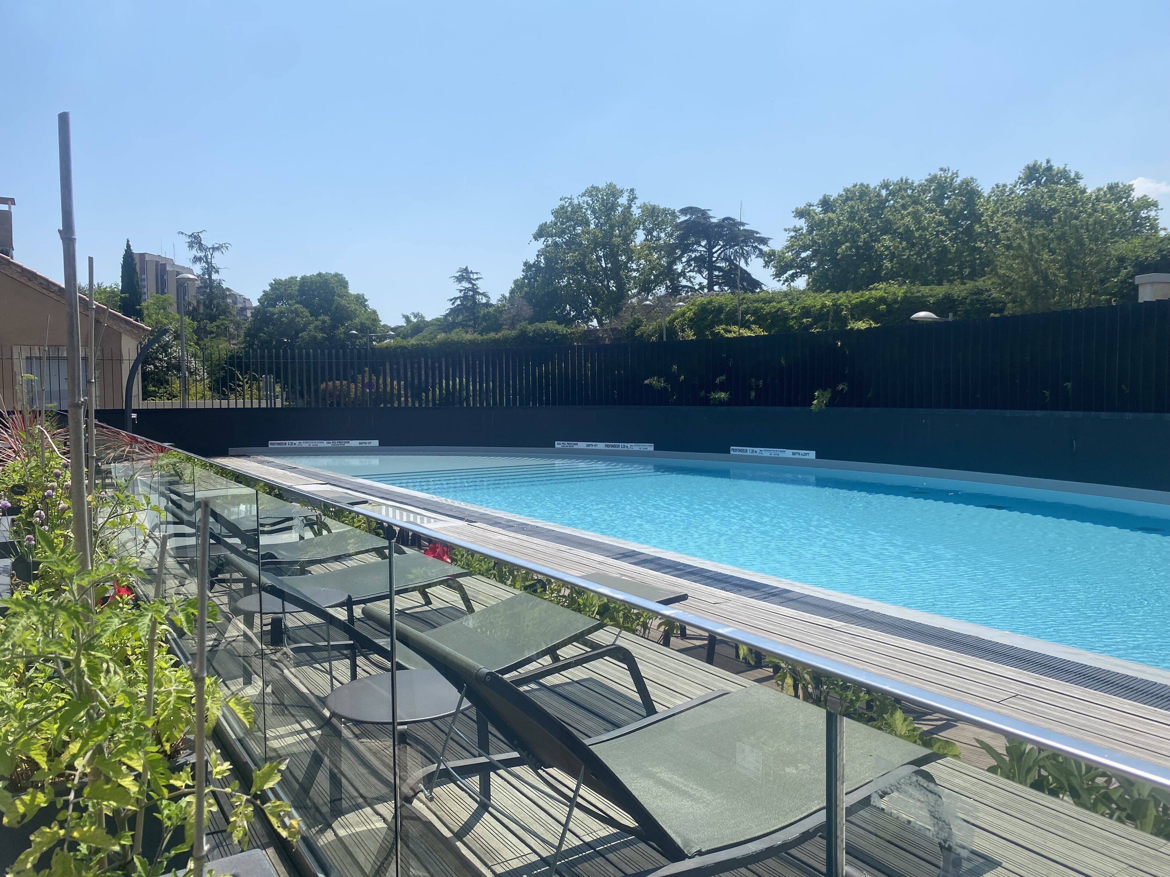 outdoor pool, open 8:00 am to 8:00 pm, pool umbrellas, pool loungers