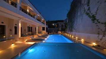 Seasonal outdoor pool, open 10:30 AM to 8:30 PM, pool umbrellas