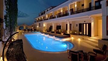 Seasonal outdoor pool, open 10:30 AM to 8:30 PM, pool umbrellas