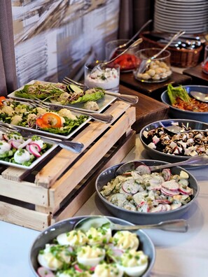 A buffet with various dishes including salads, meatballs, and seafood. - Hotel Amax (Mikolajki)