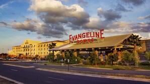 A hotel with a prominent sign reading "EVANGELINE DOWNS."