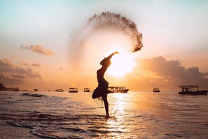 On the beach, white sand, sun loungers, scuba diving