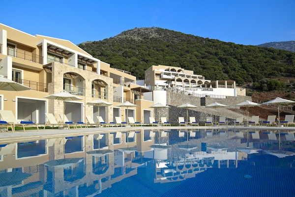 Indoor pool, pool umbrellas, sun loungers