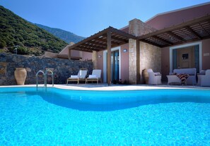 Indoor pool, pool umbrellas, pool loungers