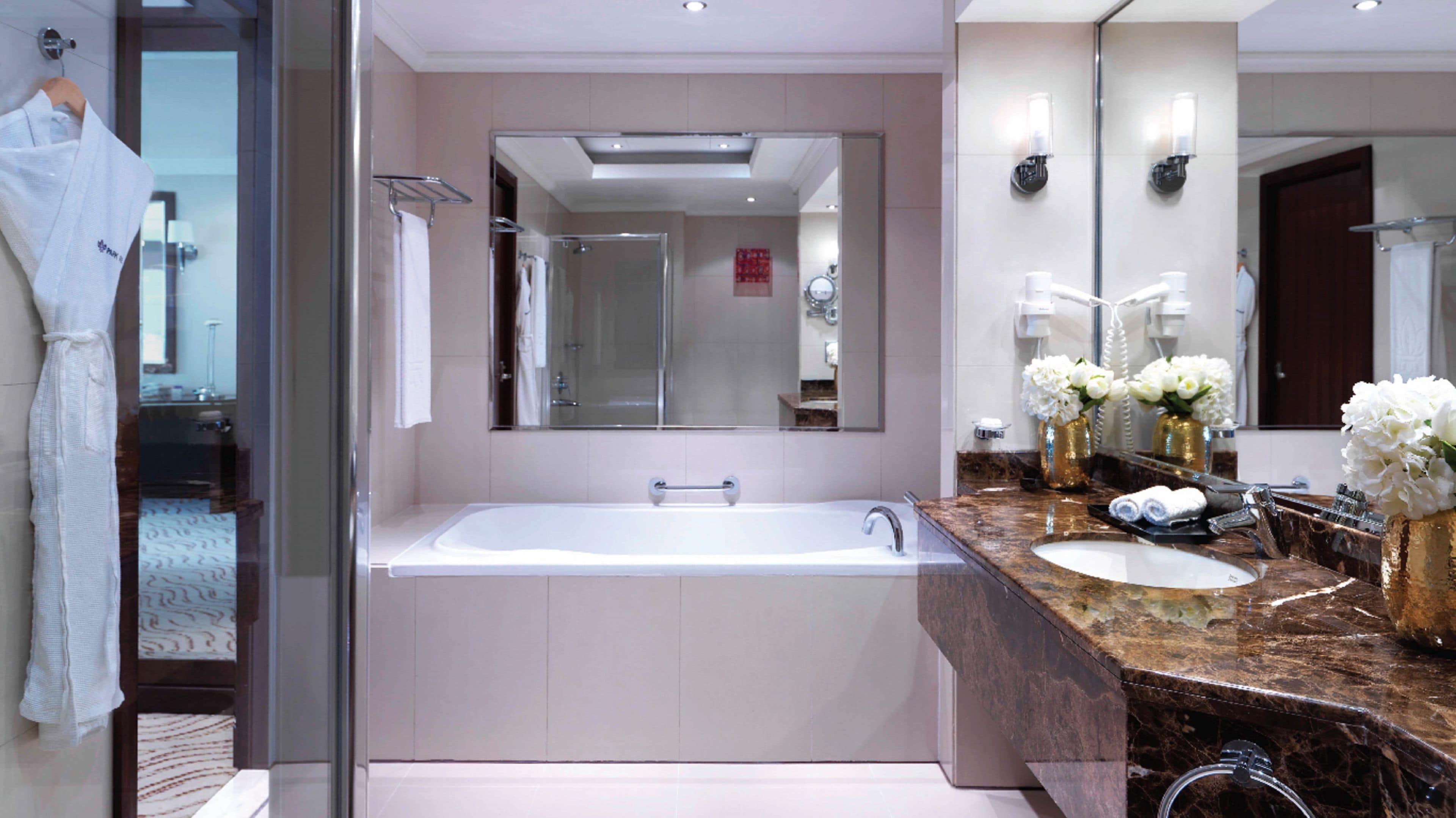 separate bathtub and shower, hair dryer, bidet, towels