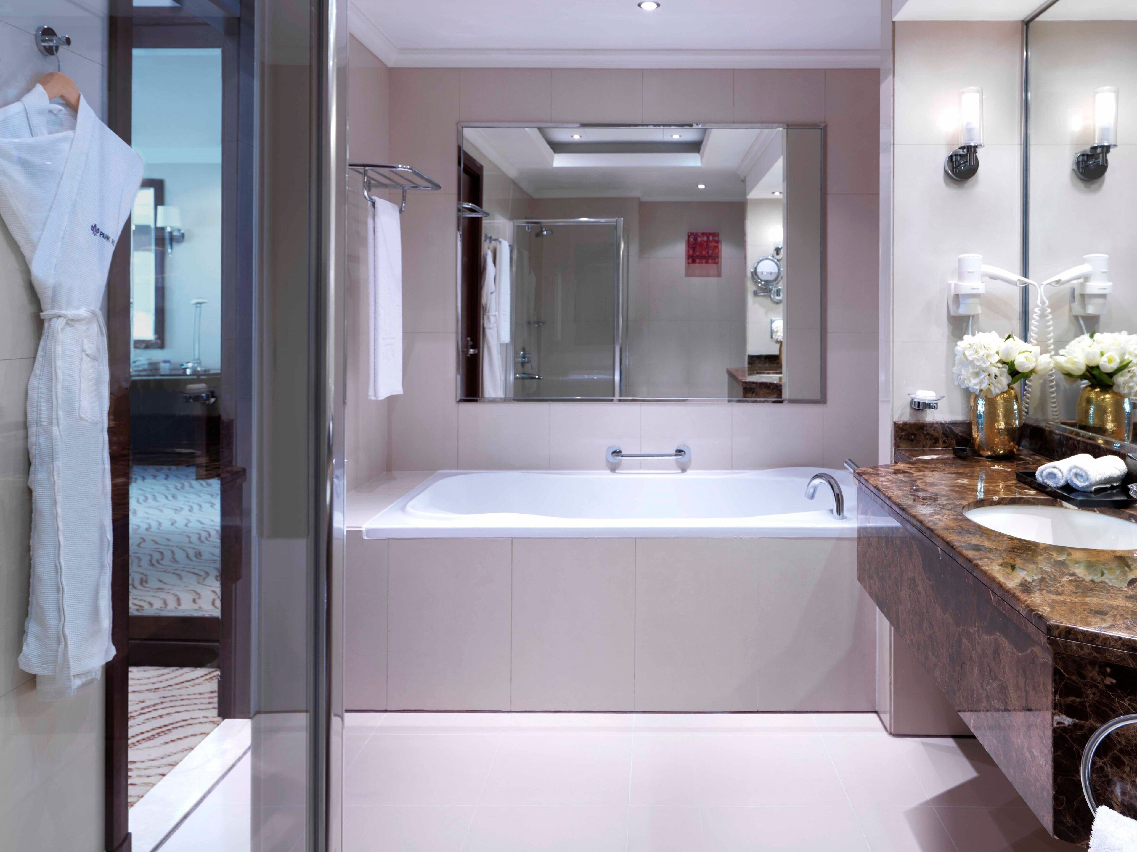 separate bathtub and shower, hair dryer, bidet, towels