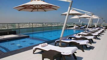 Outdoor pool, pool umbrellas, pool loungers