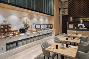 Daily buffet breakfast (SGD 41.97 per person)