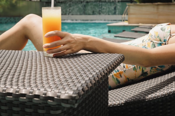 Outdoor pool, open 6:00 AM to 10:00 PM, pool loungers