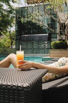 Outdoor pool, open 6:00 AM to 10:00 PM, pool loungers