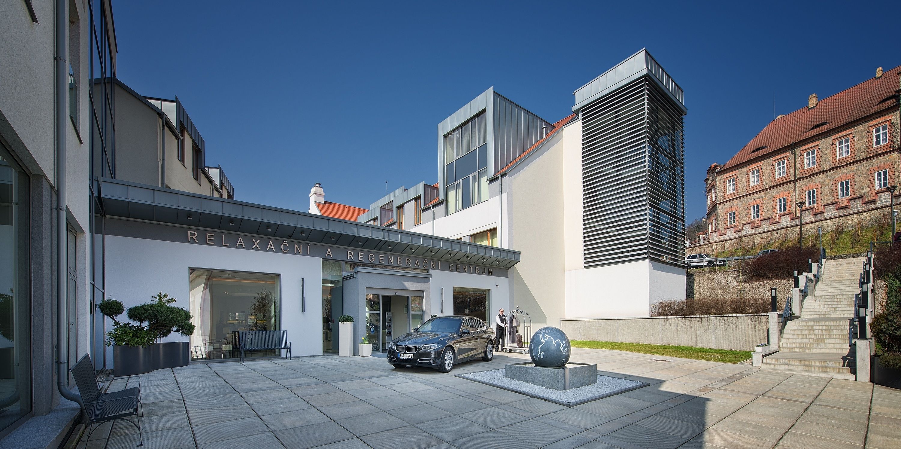 A modern building with a sign reading "REGENERACNI A REGENERACNI CENTER".