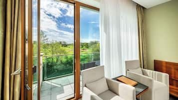 Deluxe Double Room with Golf Course View and Balcony | Minibar, in-room safe, desk, blackout drapes