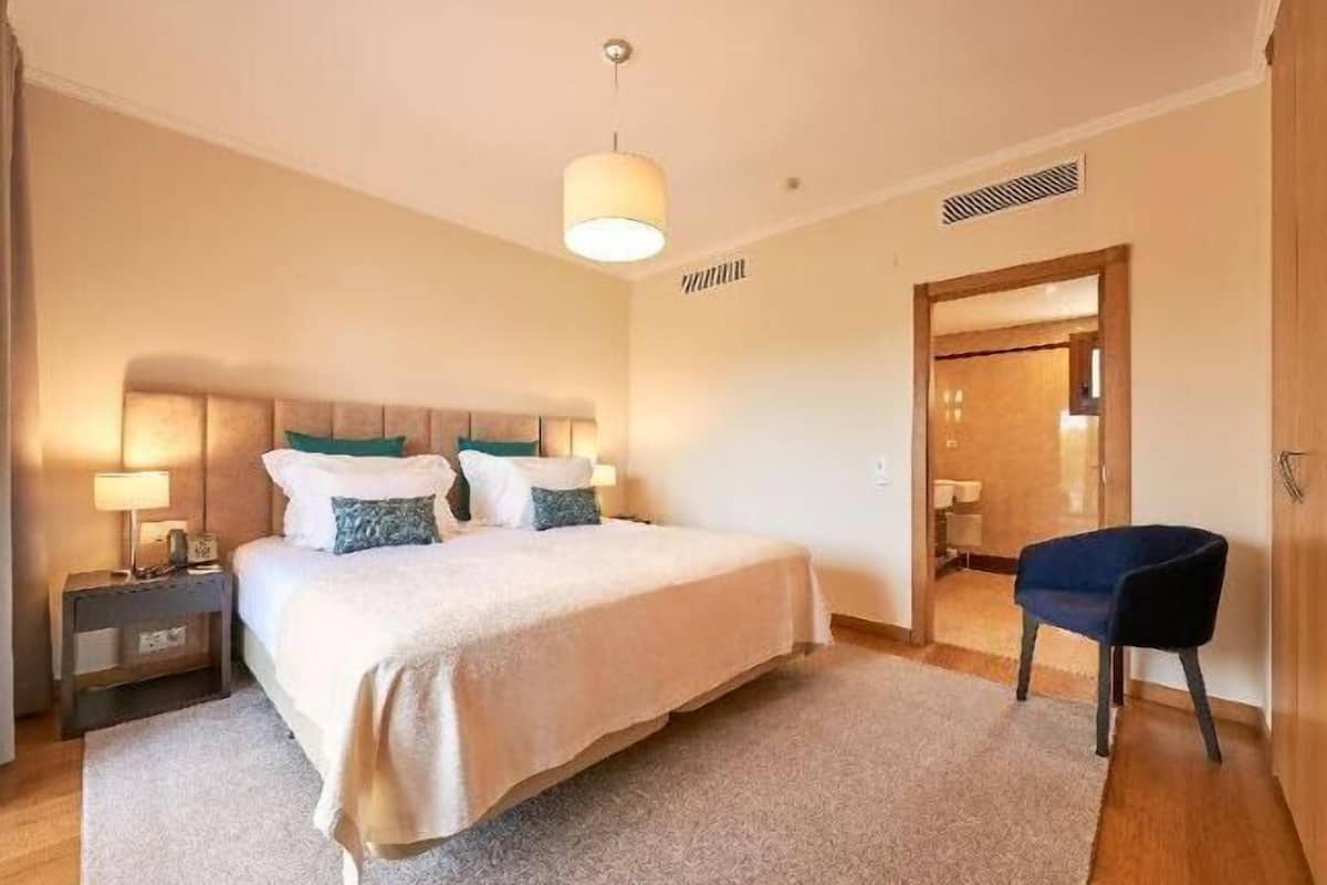 Hypo-allergenic bedding, down duvets, in-room safe