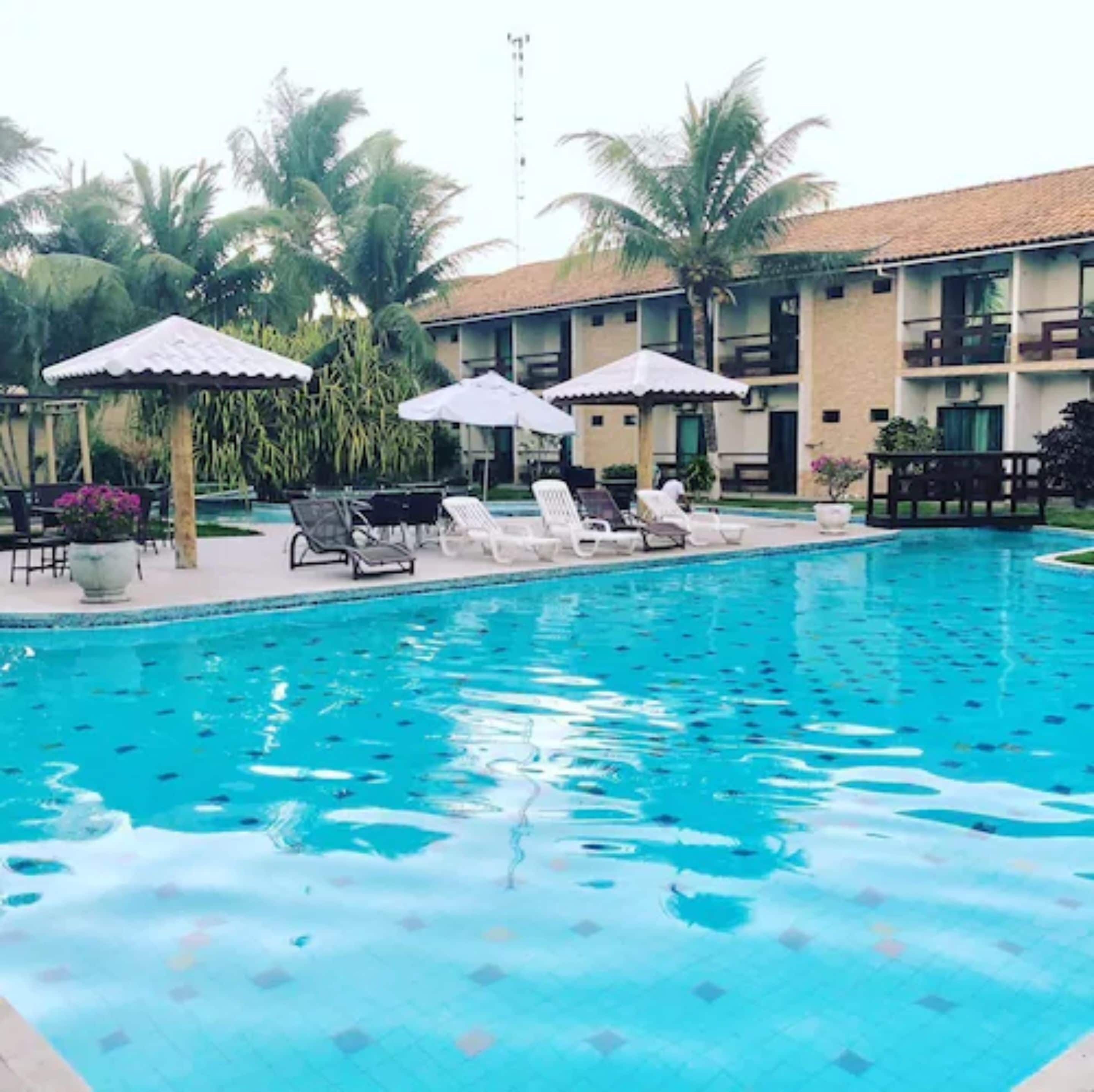 outdoor pool, pool umbrellas, pool loungers