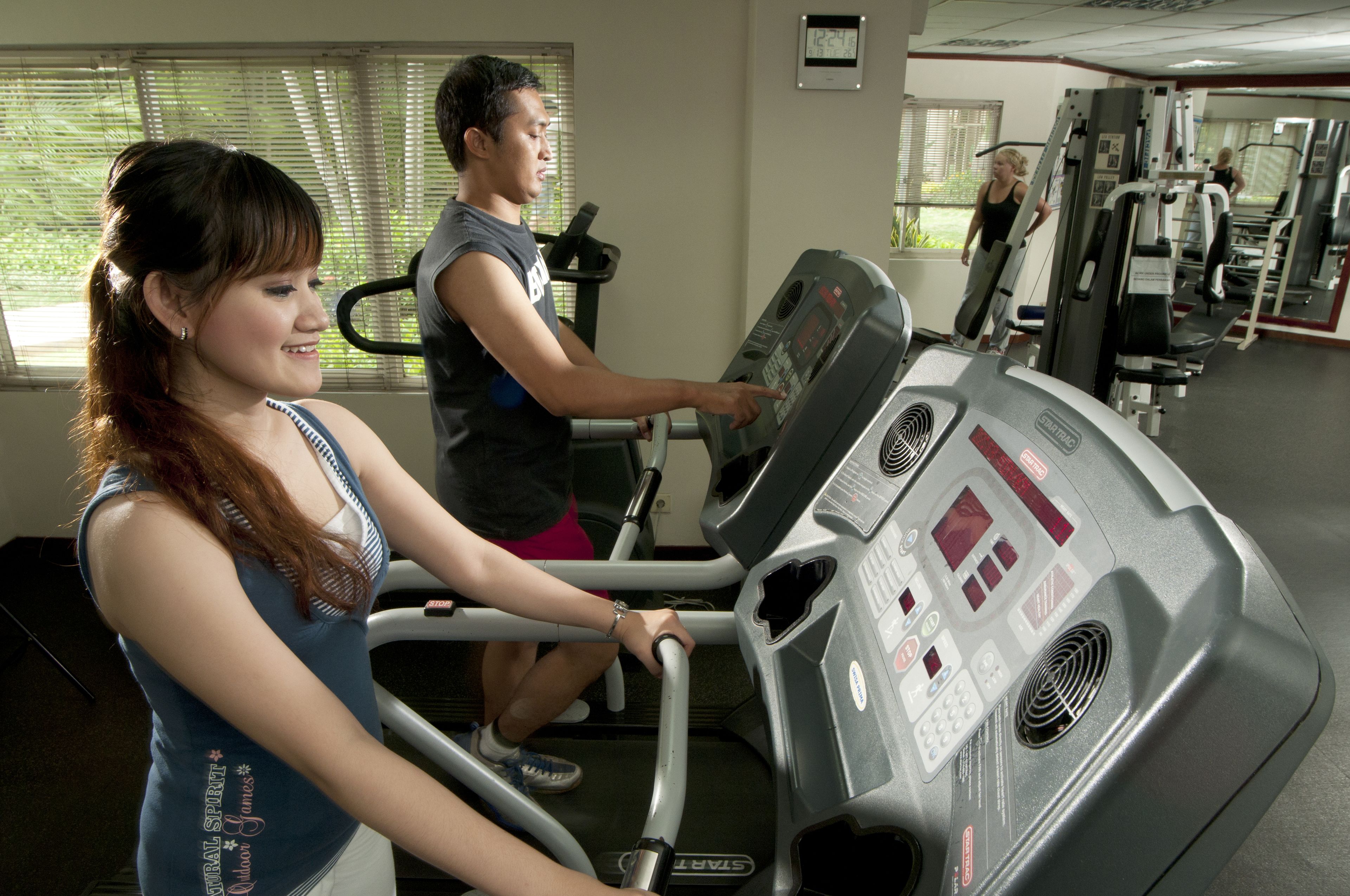 A gym with treadmills and exercise equipment.