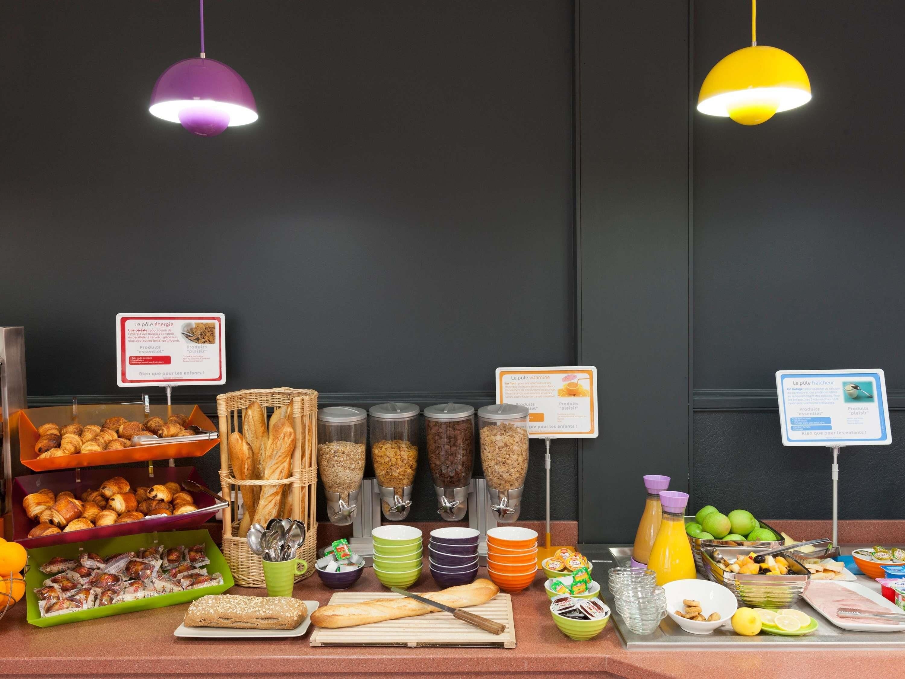 A breakfast buffet with various food items and condiments.