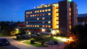A multi-story hotel with a flat roof and a sign reading "HOTEL PANON". - Hotel Panon (Hodonin)