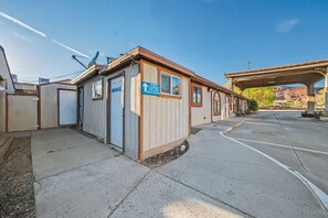 A small building with a sign indicating guest laundry, ice and restrooms.