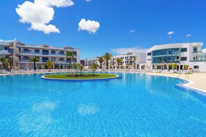 Outdoor pool, pool umbrellas, sun loungers