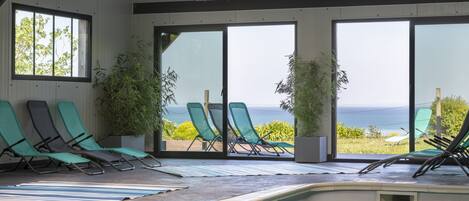 Indoor pool, open 7:00 AM to 10:00 PM, pool umbrellas, pool loungers