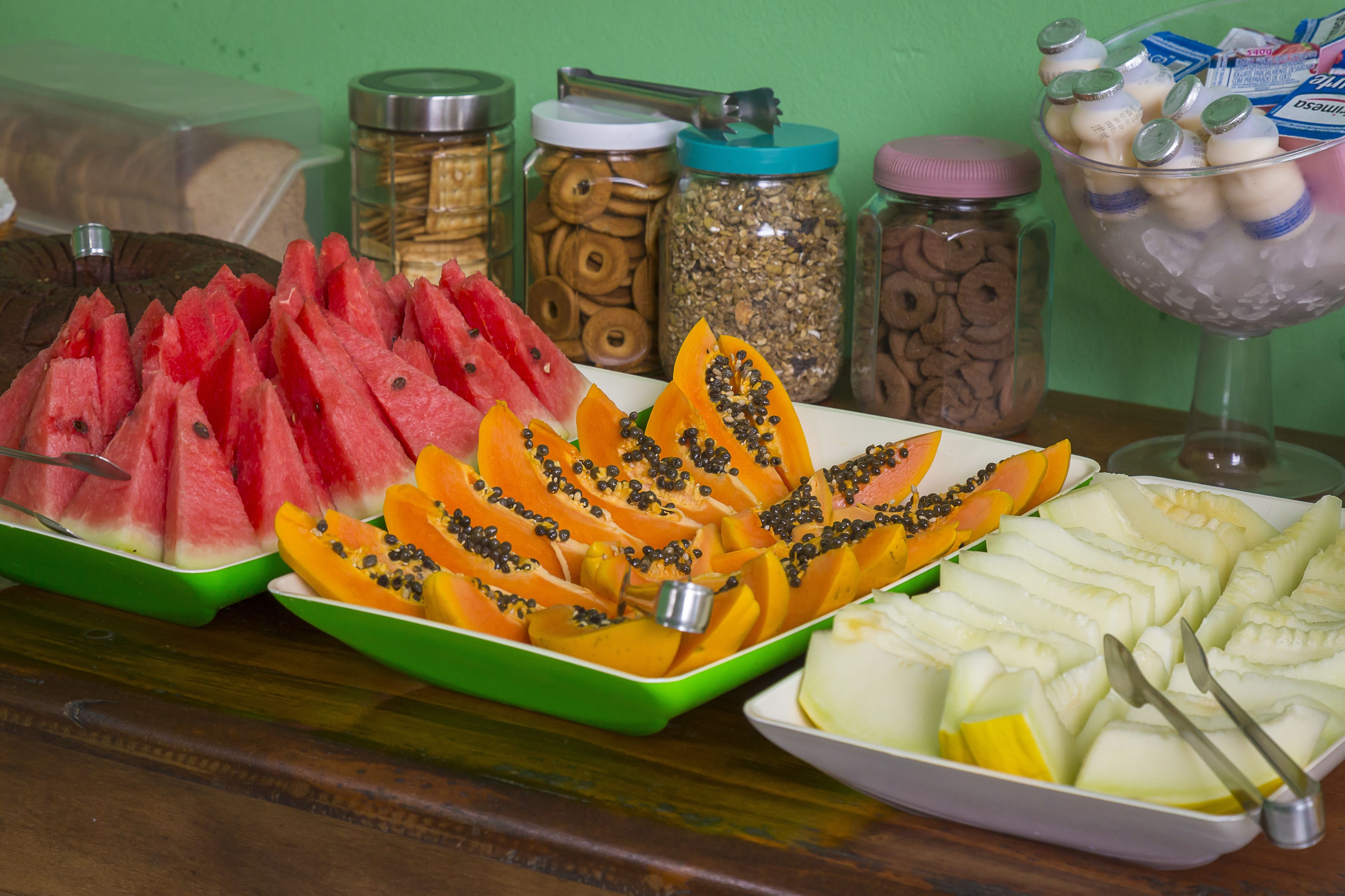 A variety of fruits and snacks arranged on a table.