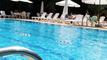 Indoor pool, seasonal outdoor pool, pool umbrellas, pool loungers