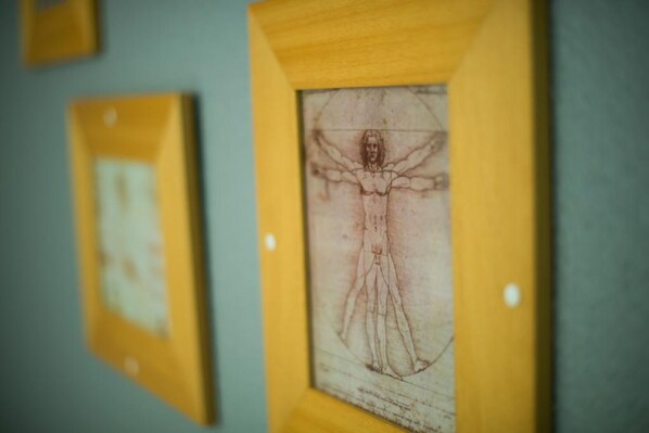 A framed artwork on a wall.