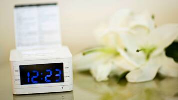 A digital clock displaying 12:23, with a menu button and sleep mode option.