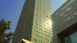 A tall building with the name "Somerset" at the top and "International Building" on the side. - Somerset International Building Tianjin (Tianjin)