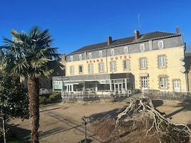 A building labeled 'Grand Hotel' with a restaurant on the ground floor.