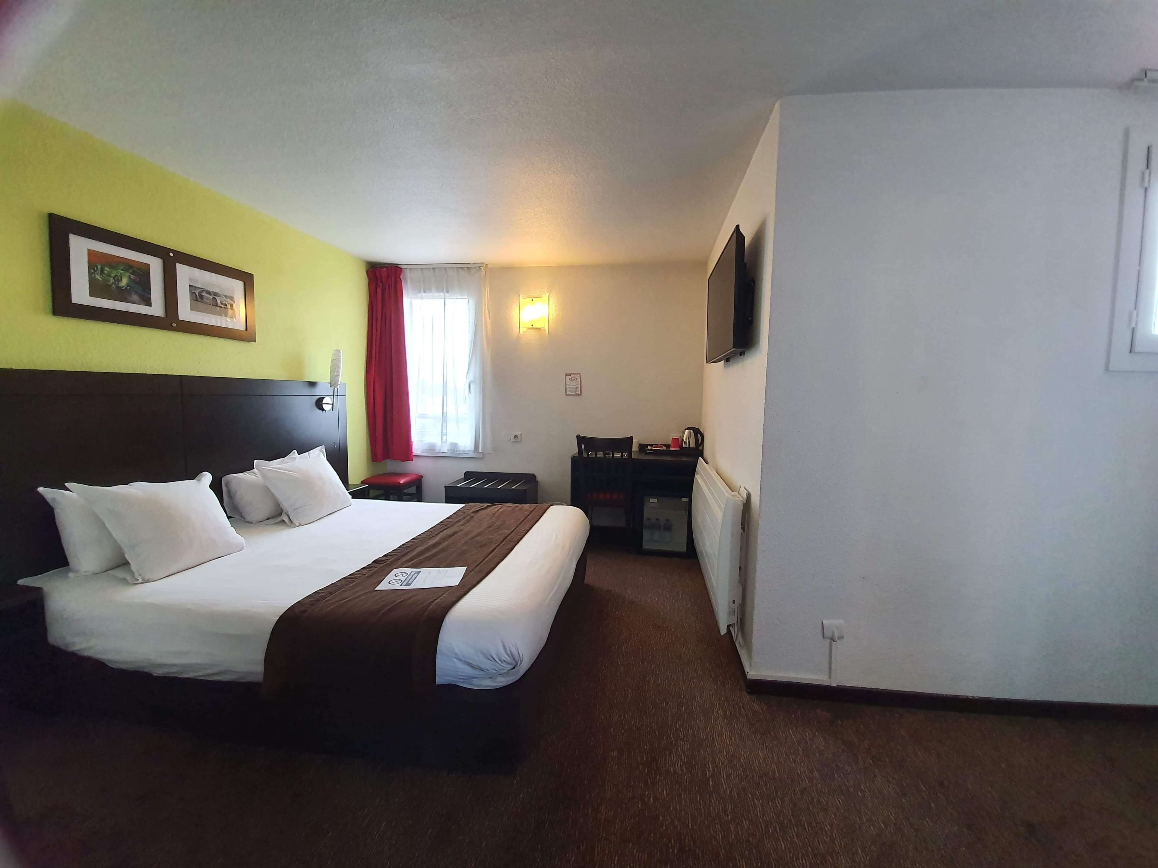 memory-foam beds, desk, laptop workspace, blackout curtains