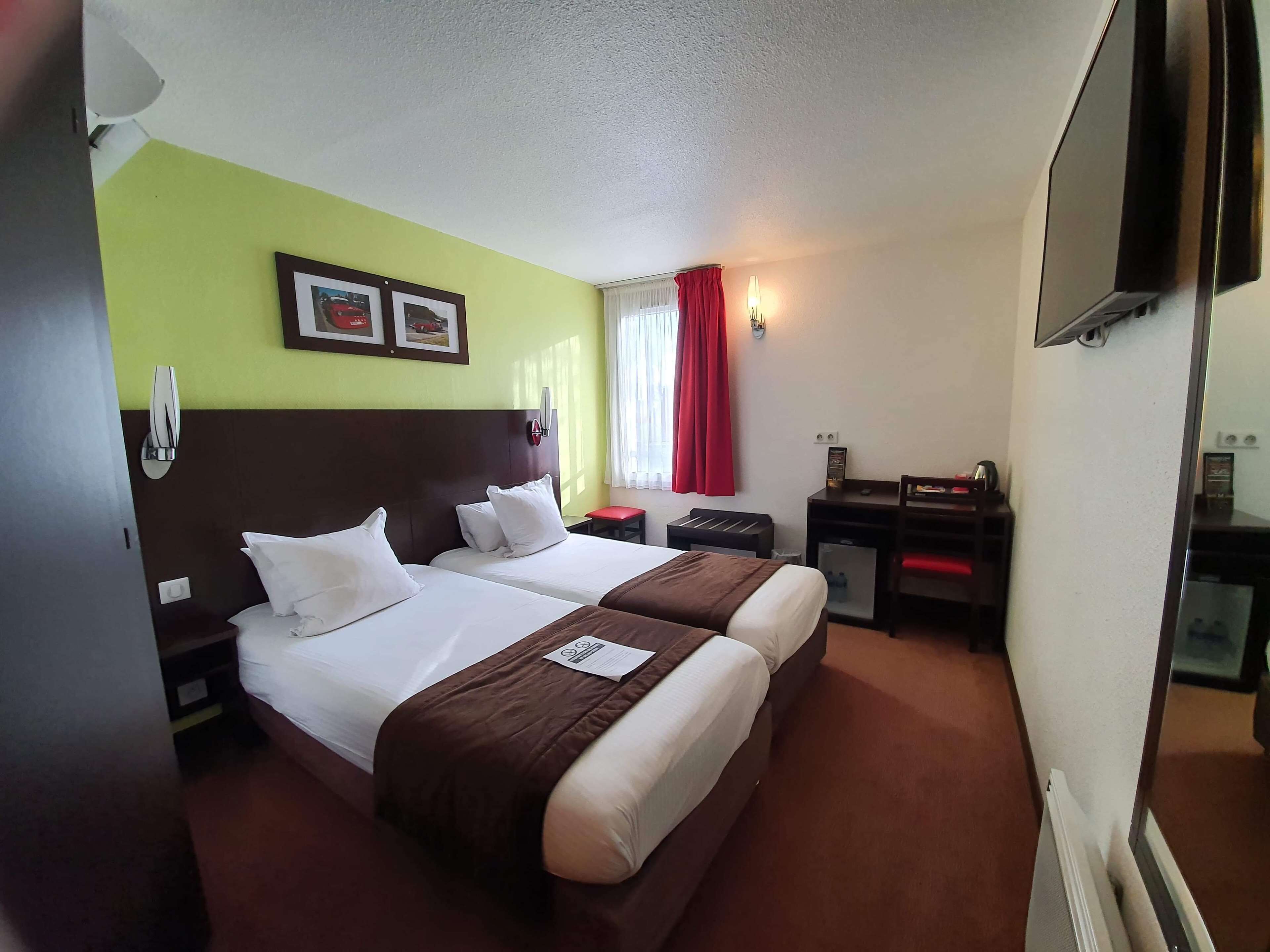 memory-foam beds, desk, laptop workspace, blackout curtains