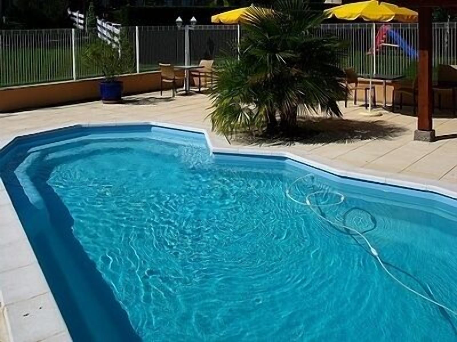 outdoor pool, open 2:00 pm to 8:00 pm, pool umbrellas, pool loungers