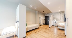 Monolocale Tipo B Superior | Living area | LED TV - Casa Temporanea (Bologna)