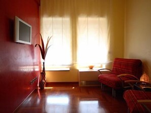 Junior suite (4 people) | Woonruimte | Lcd-televisie