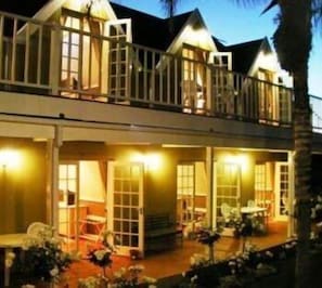 A two-story building with balconies and large windows. - Yamkela Guest House (Oudtshoorn)