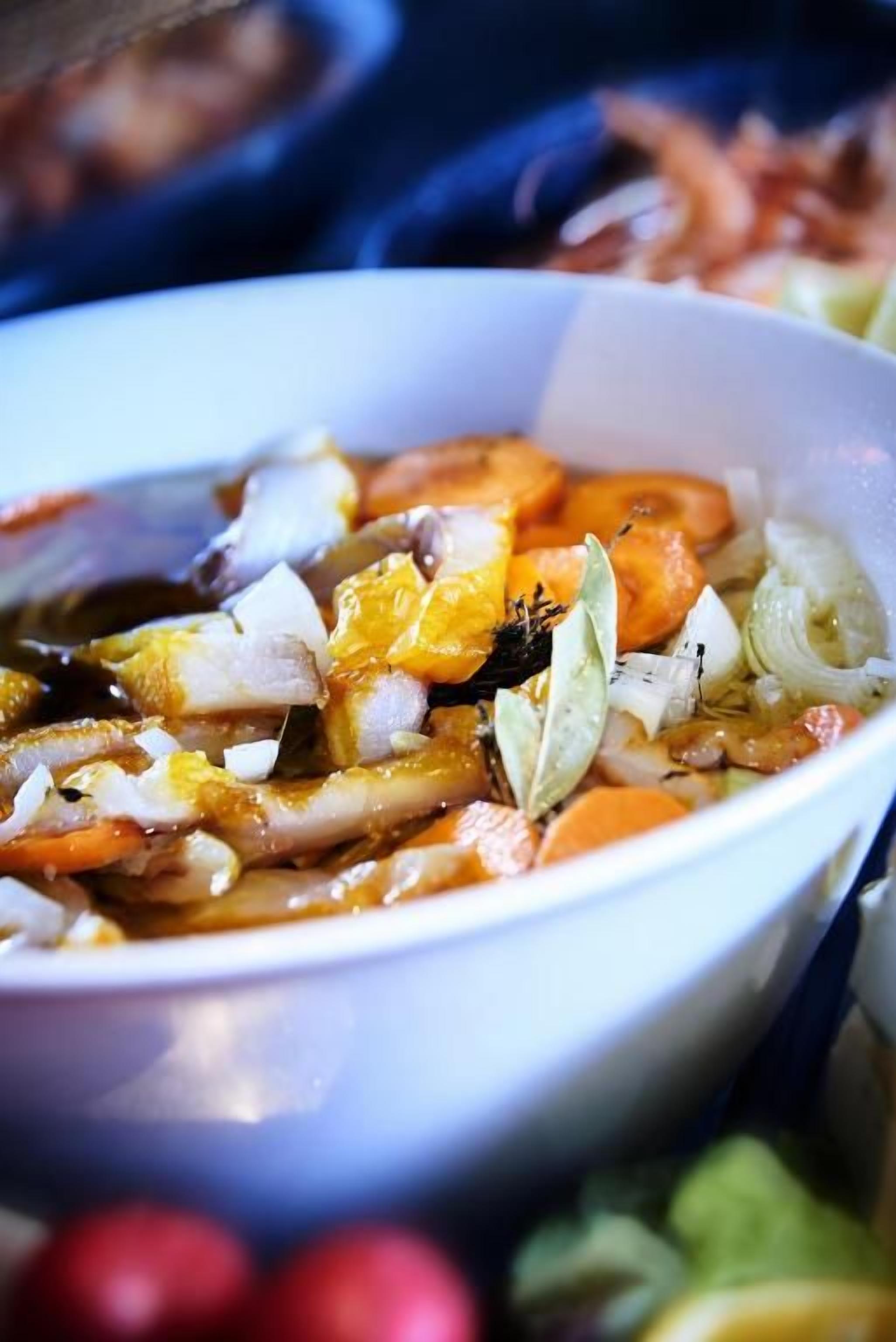 A bowl of food with various ingredients.