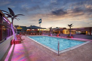 Seasonal outdoor pool, open 9:00 AM to 10:00 PM, pool umbrellas