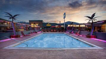 Seasonal outdoor pool, open 9:00 AM to 10:00 PM, pool umbrellas