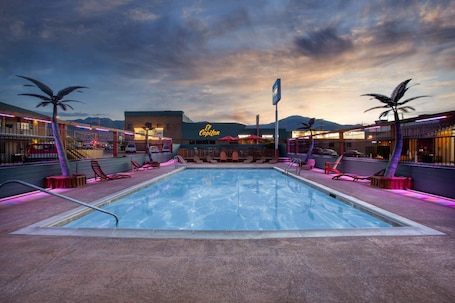 Seasonal outdoor pool, open 9:00 AM to 10:00 PM, pool umbrellas