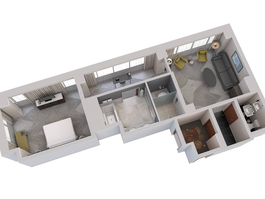 Un plan 3D d’une chambre d’hôtel comprenant un lit, un bureau, une salle de bain et un coin salon avec un canapé et un téléviseur.