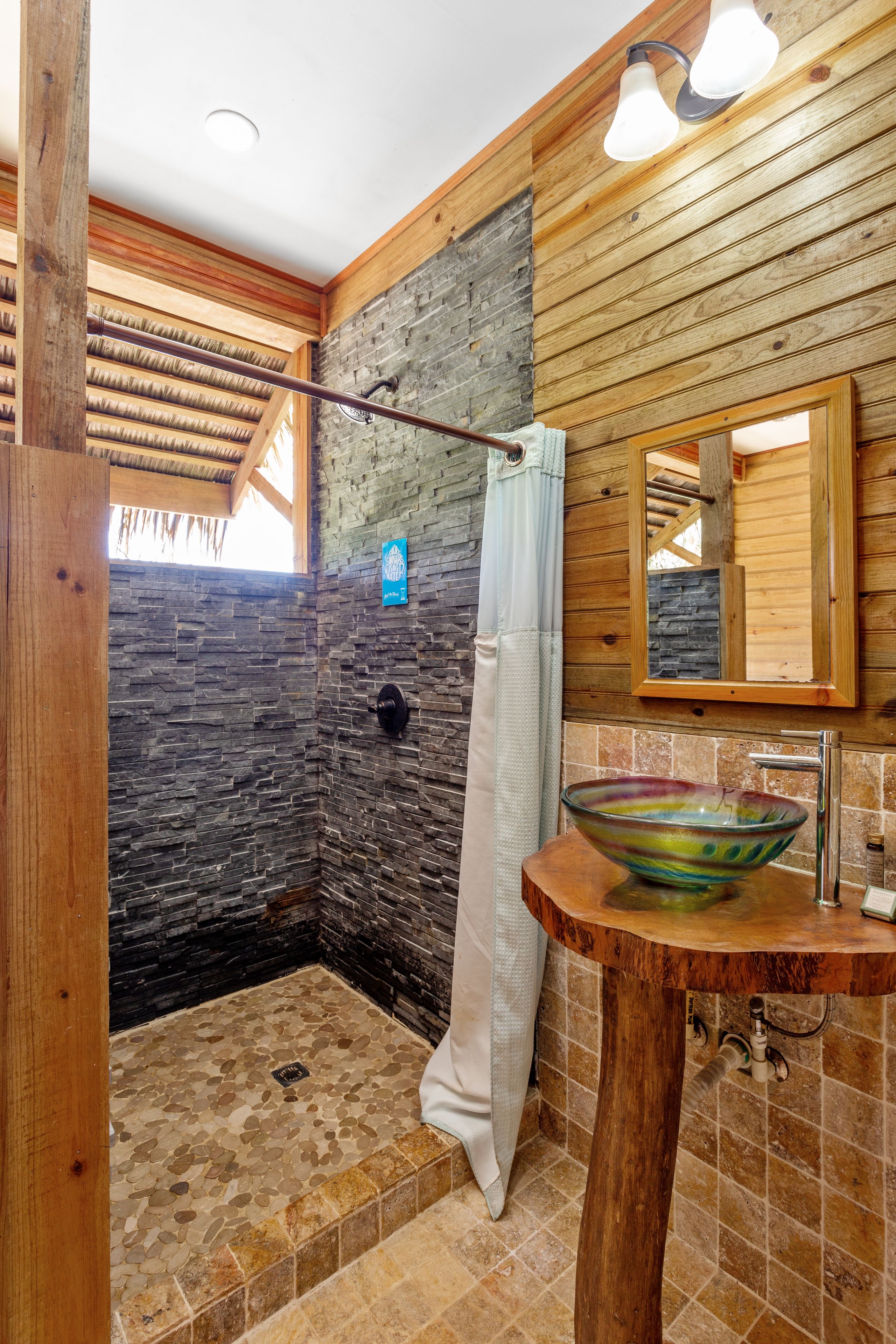 shower, hair dryer, towels, shampoo