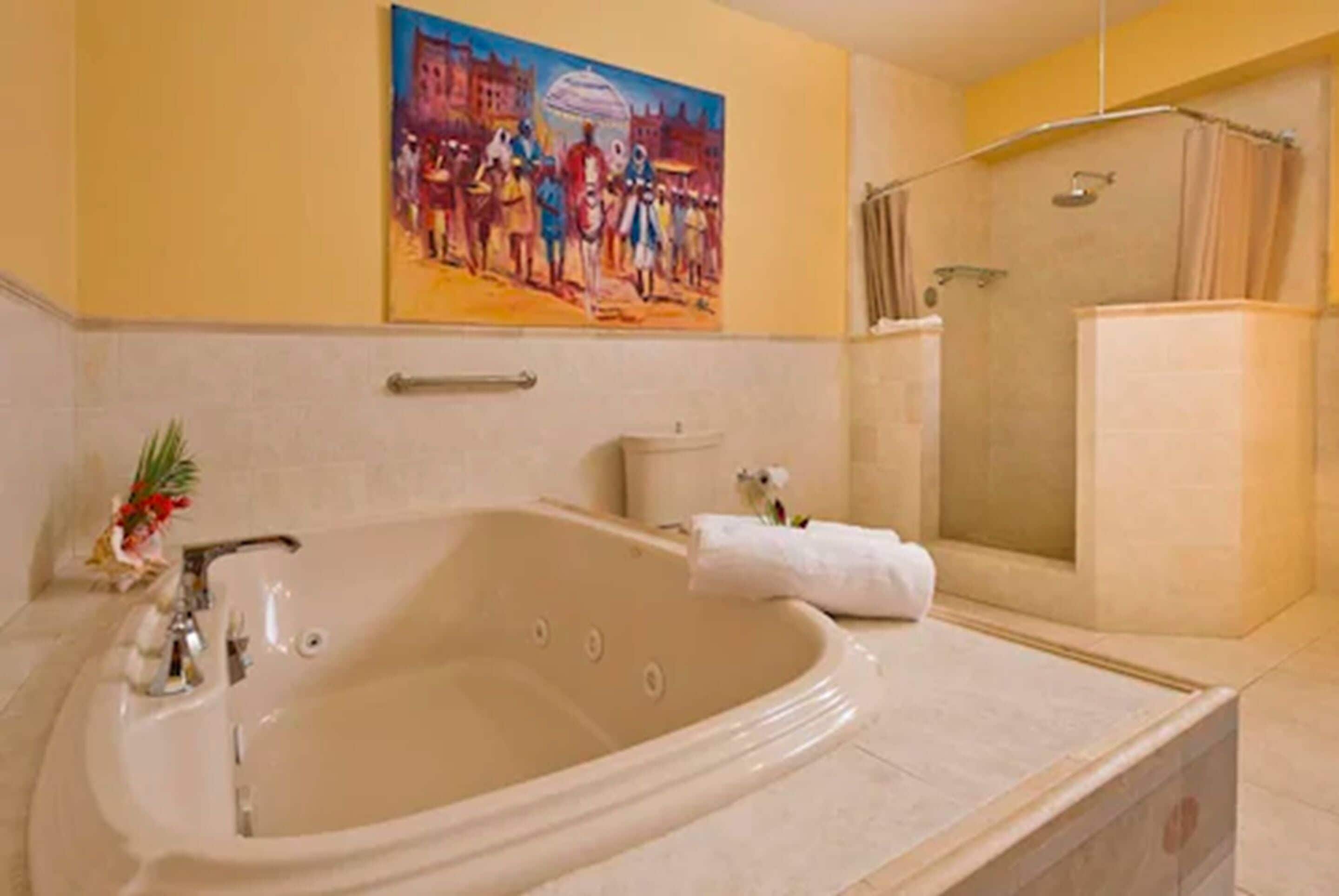 premium suite, 1 king bed, ocean view (jacuzzi) | bathroom | combined shower/bathtub, free toiletries, hair dryer, bathrobes
