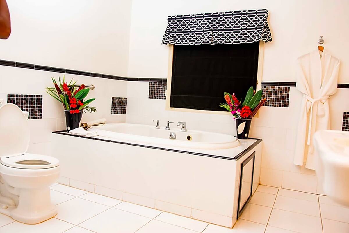 premium suite, 1 king bed, ocean view (jacuzzi) | bathroom | combined shower/bathtub, free toiletries, hair dryer, bathrobes