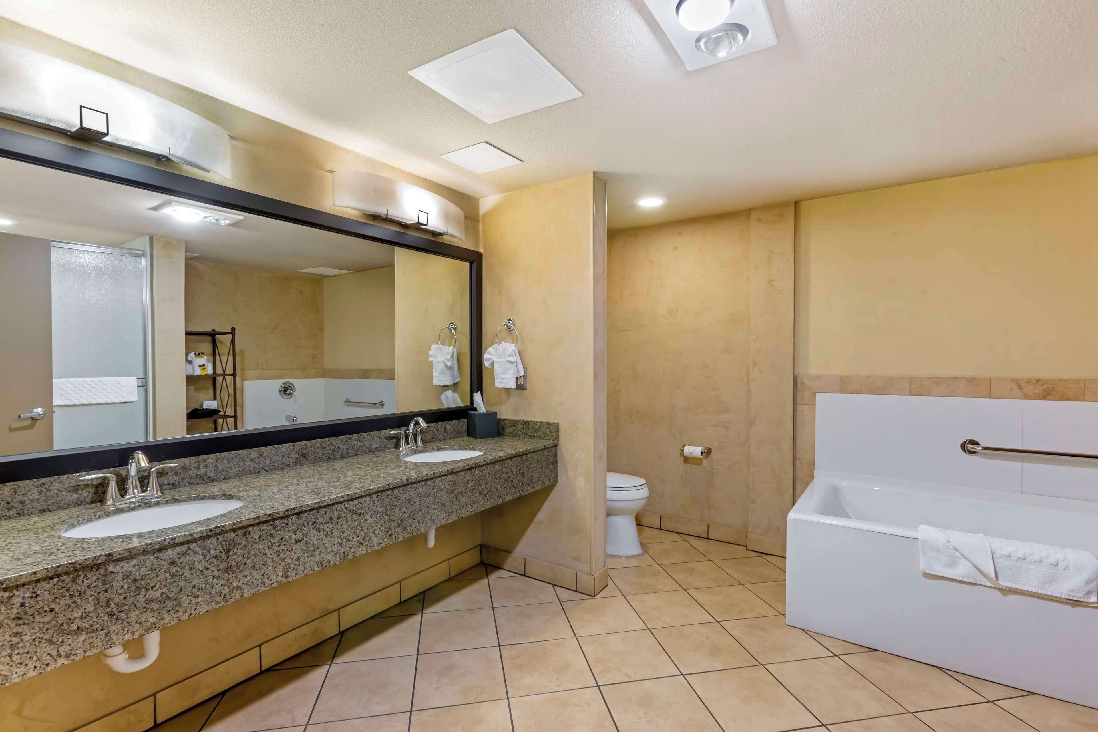 suite, 1 king bed, non smoking, refrigerator & microwave (with sofabed) | bathroom | combined shower/bathtub, hair dryer, towels