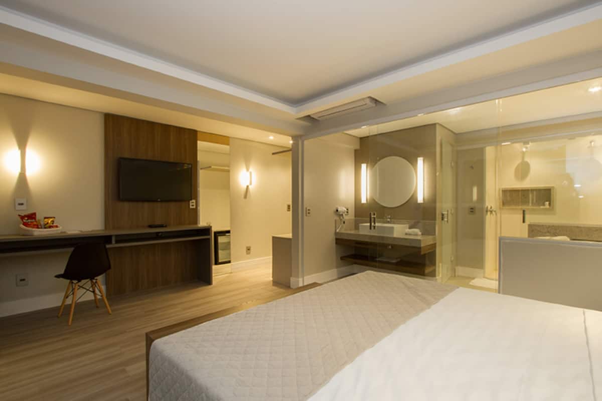 superior suite, 1 king bed, hot tub | minibar, in-room safe, desk, laptop workspace