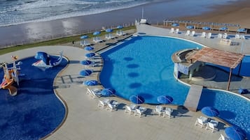Outdoor pool, pool umbrellas, sun loungers