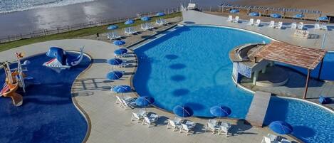 Outdoor pool, pool umbrellas, sun loungers