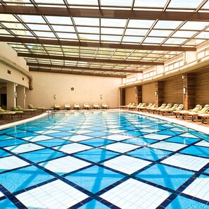 A large indoor swimming pool with a tiled floor and a glass ceiling. - Paloma Pasha  - All inclusive (Menderes)