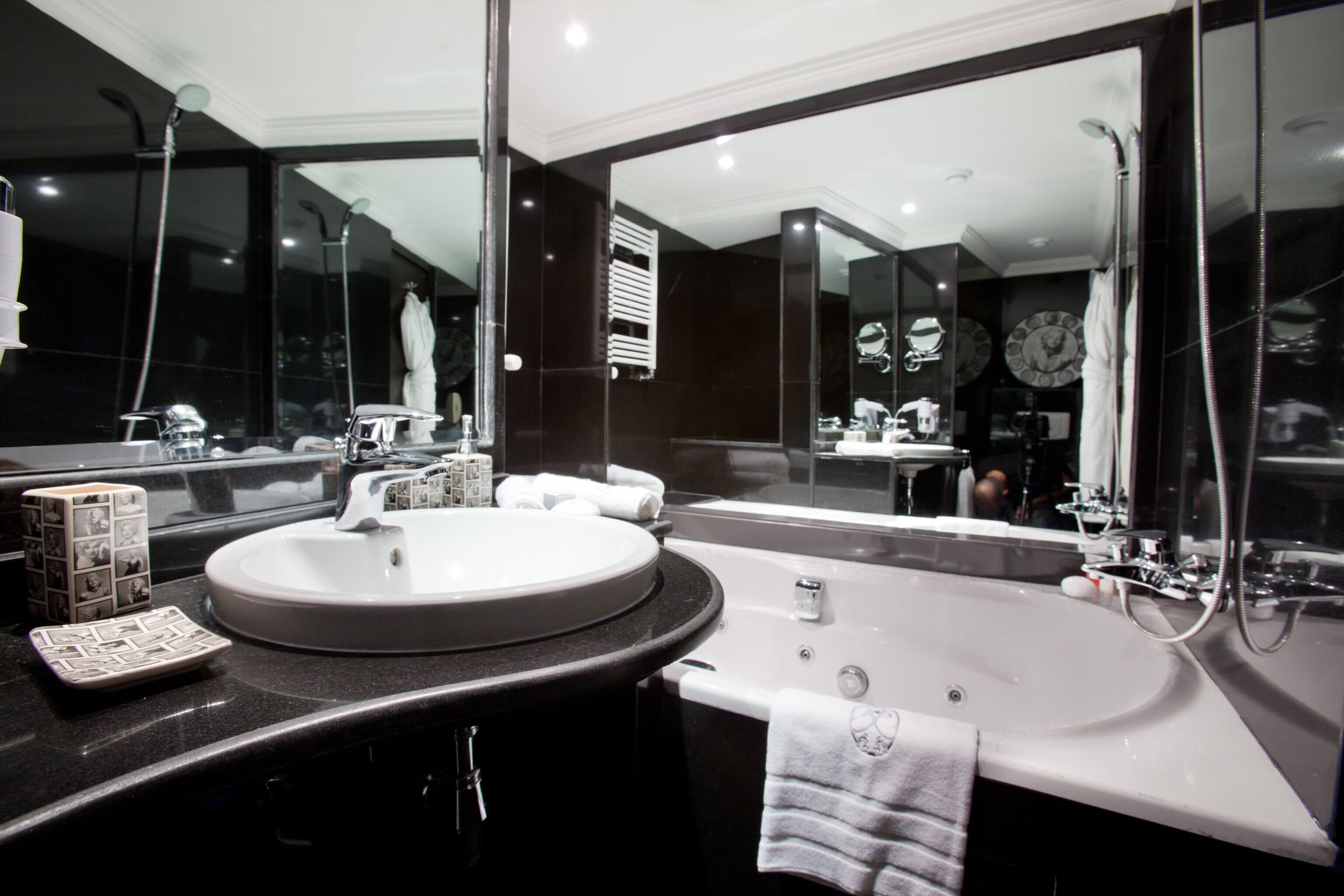 prestige suite with balcony | bathroom | deep-soaking bathtub, rainfall showerhead, designer toiletries